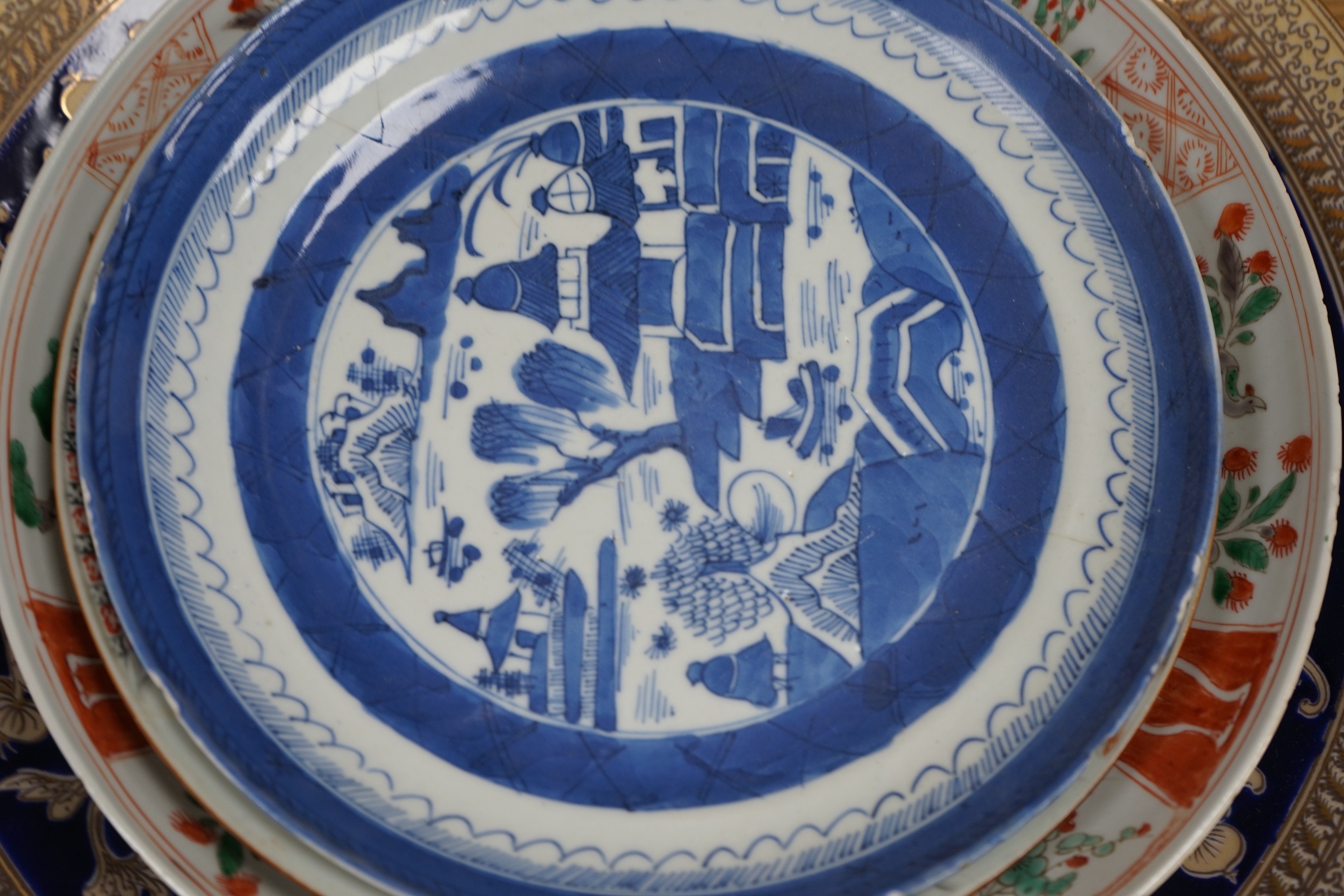 A group of 18th century and later Chinese enamelled and blue and white porcelain dishes and three bowls, Largest dish 35.5 cm diameter